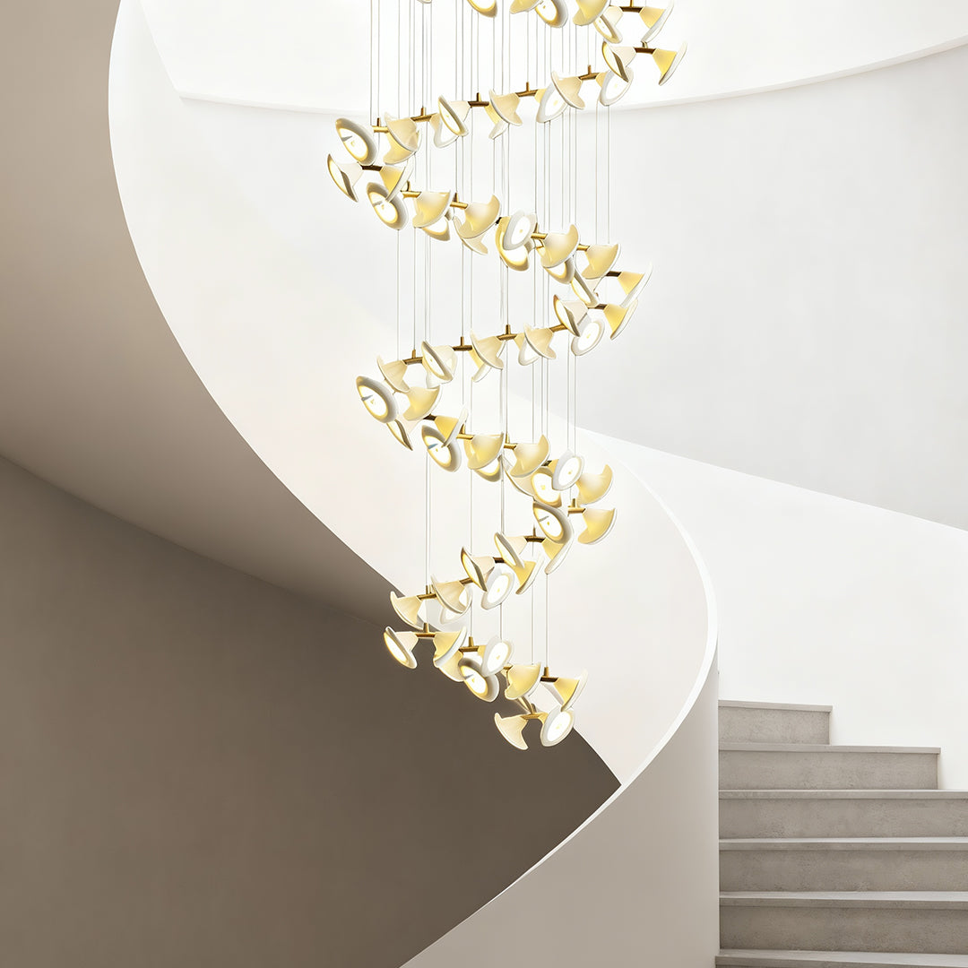 Brass chandelier for high ceilings with spiral lighting elements.