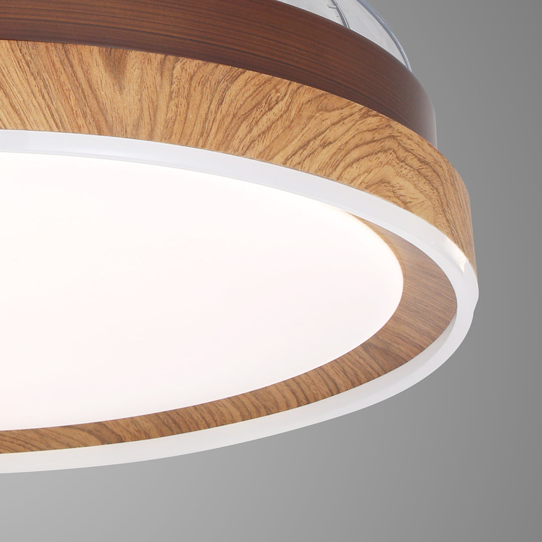 High-resolution close-up of the wood-look housing on the ceiling fan with 4 lights 