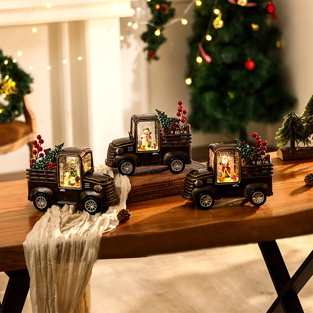 Holiday truck decor trio with lit windows creating a cozy atmosphere similar to a modern gold table lamp.