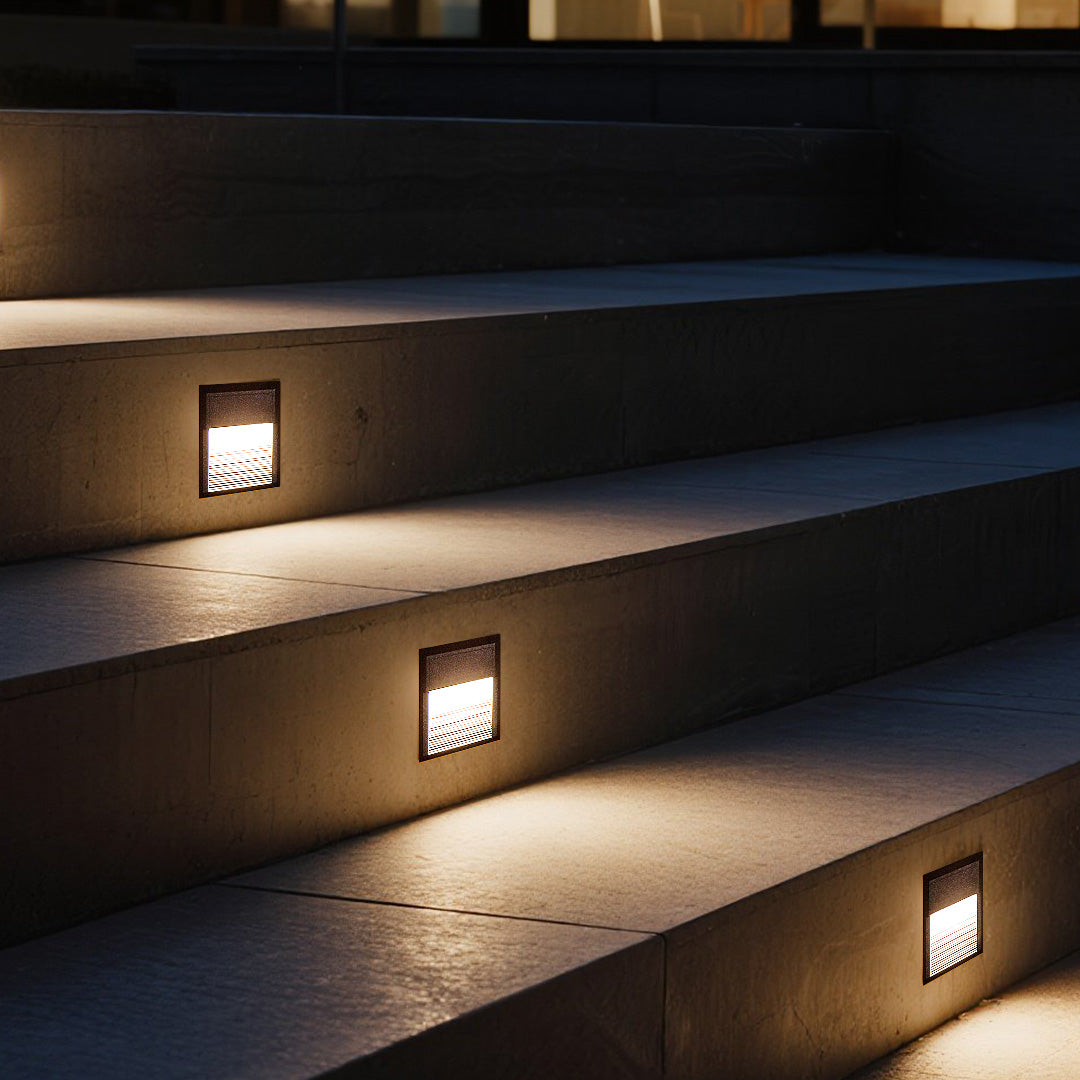 Contemporary stair lighting with built-in LED fixtures providing safety illumination on modern steps