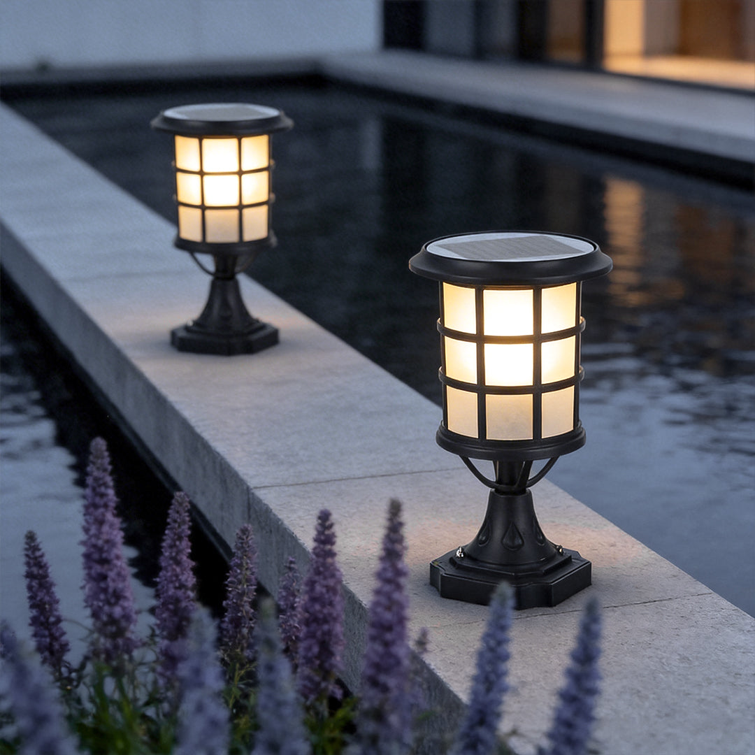 House pillar lights with a classic design, providing warm illumination near a poolside pillar.
