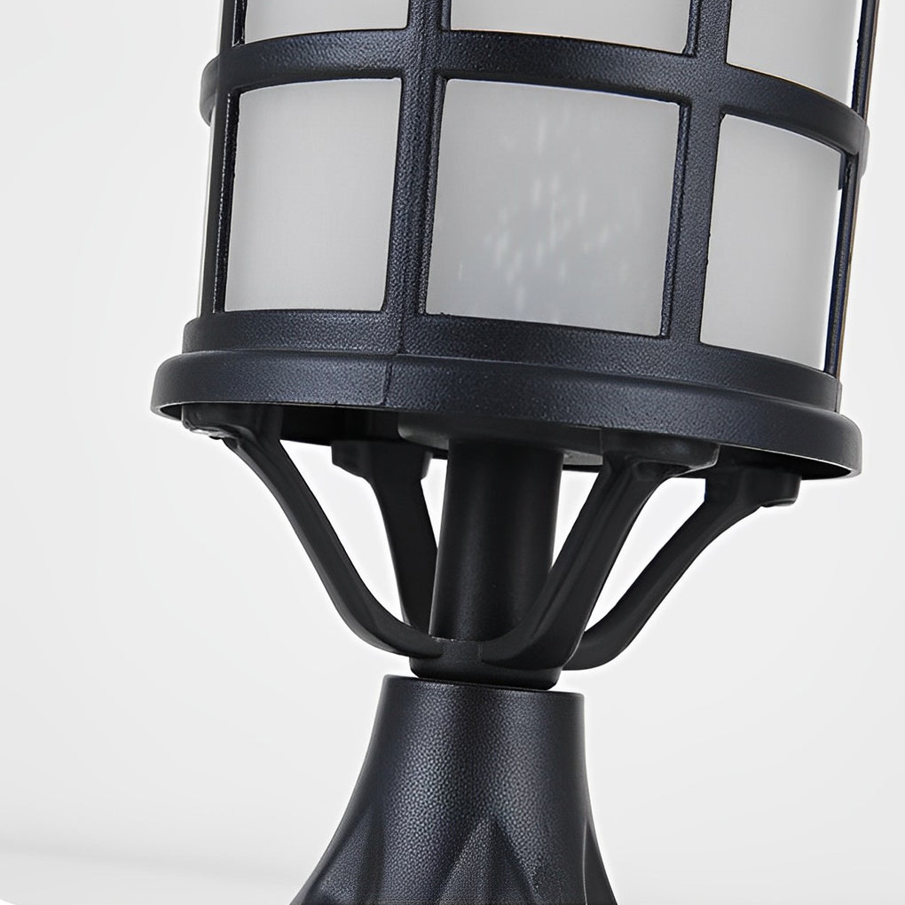 House pillar lights with a close-up of their decorative top and glass.