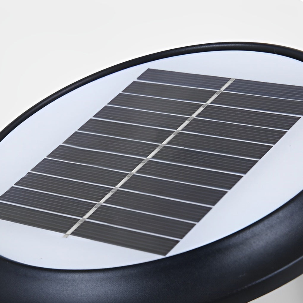 House pillar lights with a sleek design, illuminating a garden pillar.