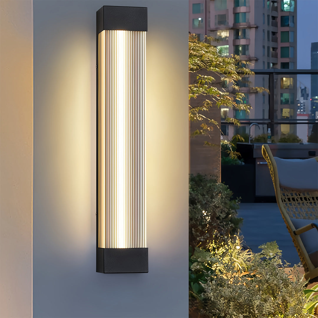 Close-up of an illuminated linear outdoor sconce design, perfect for modern balcony and garden lighting.
