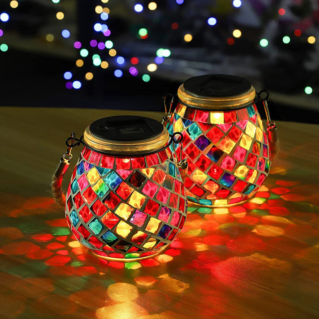 Illuminated mosaic lanterns displaying colorful light projections in rustic indoor setting