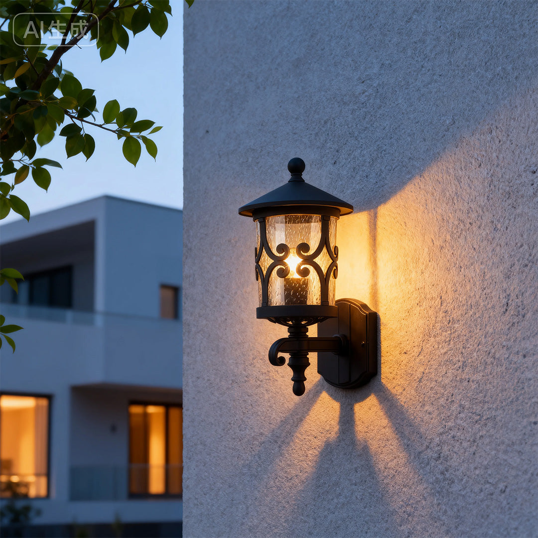Illuminated outdoor black sconce mounted on blue exterior wall creating dramatic shadows at dusk