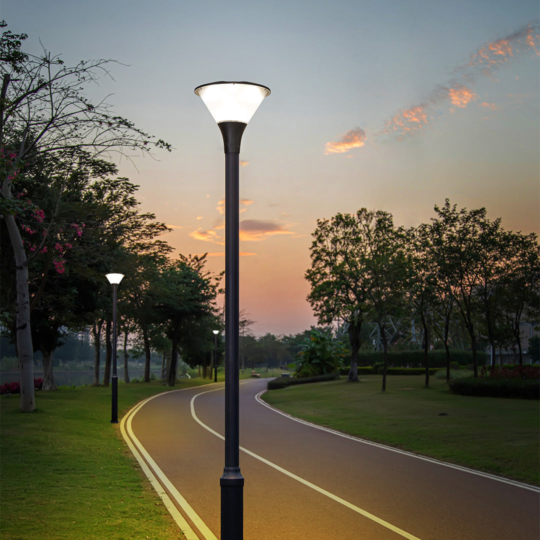 Illuminated pathway lights creating safe pedestrian walkway during golden hour sunset