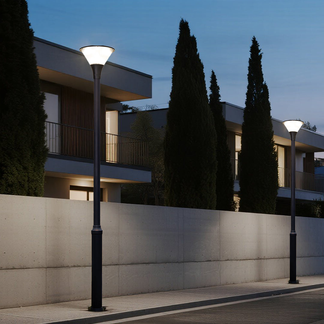 Illuminated pathway lights creating safe pedestrian walkway during golden hour sunset