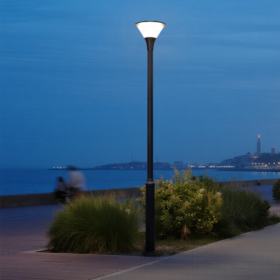 Illuminated pathway lights creating safe pedestrian walkway during golden hour sunset
