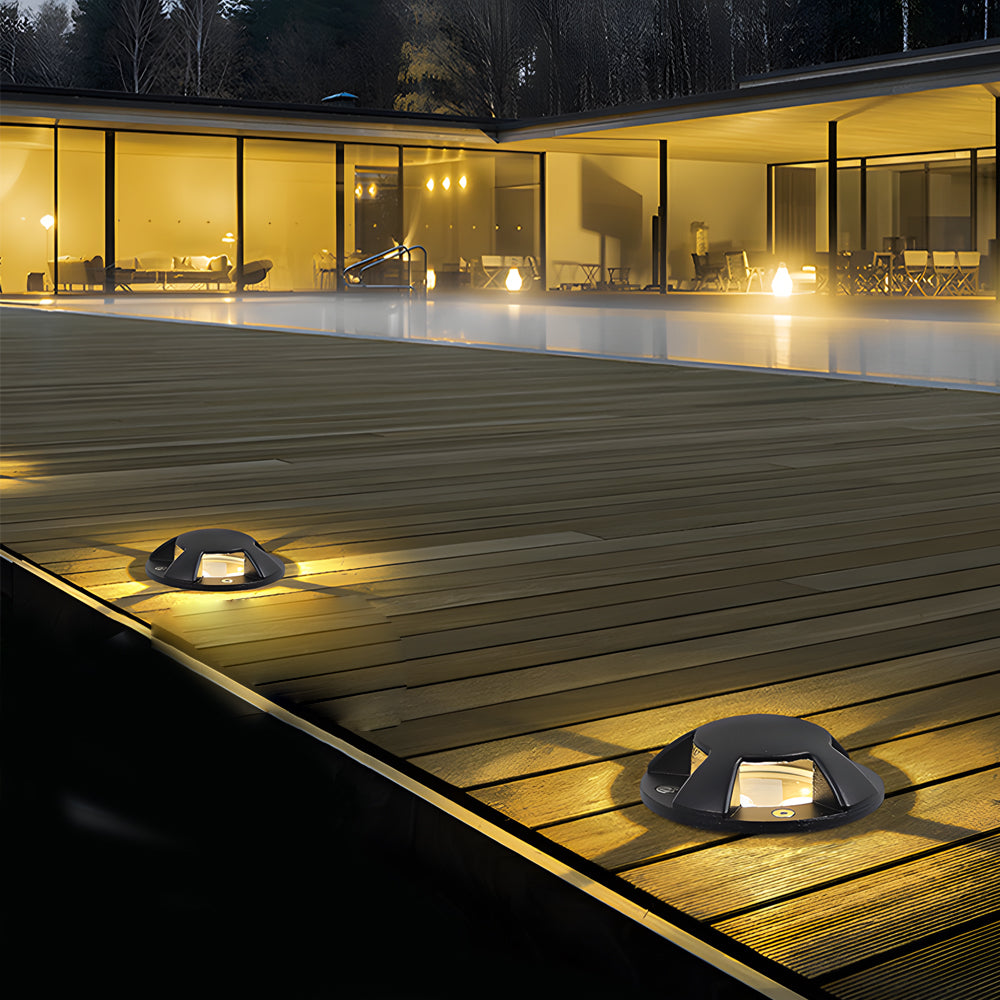 In-ground low voltage landscape lighting installed along a modern walkway, providing subtle illumination for outdoor pathways
