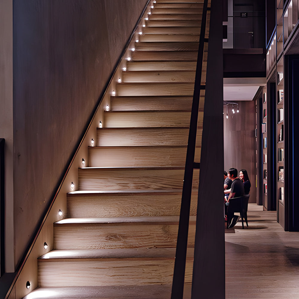 In-ground low voltage landscape lighting highlighting staircase steps, enhancing safety and ambiance in outdoor spaces.