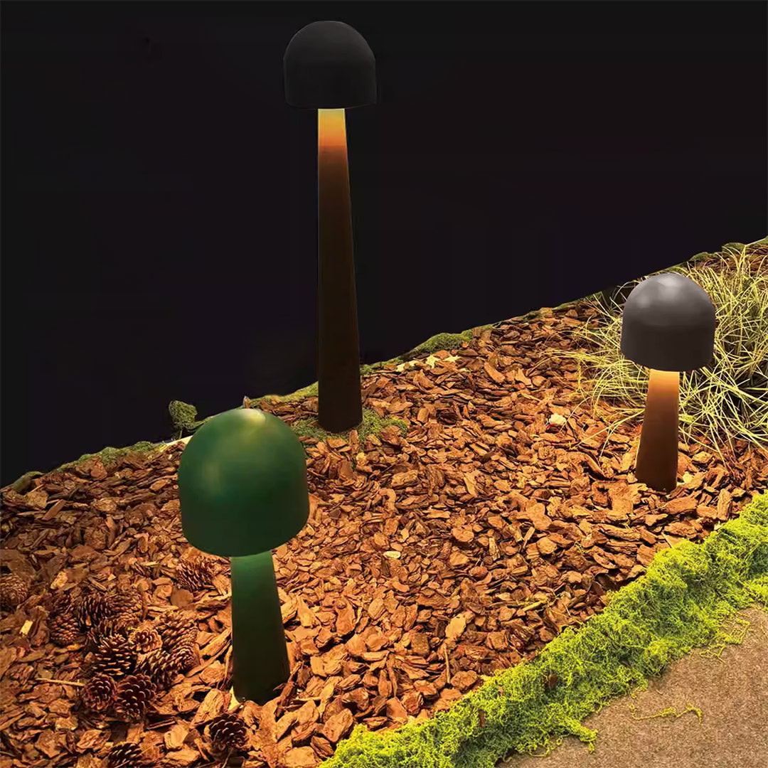 Sleek in-ground LED landscape light with a stainless steel rim, providing upward illumination for trees and shrubs