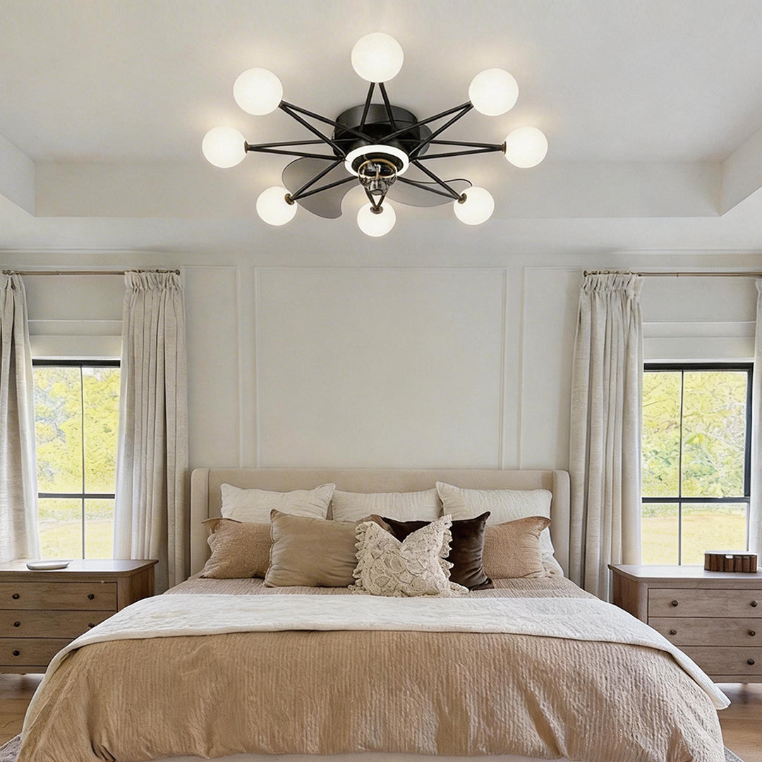 Indoor ceiling fans with lights featuring a modern black design, illuminating a cozy bedroom.