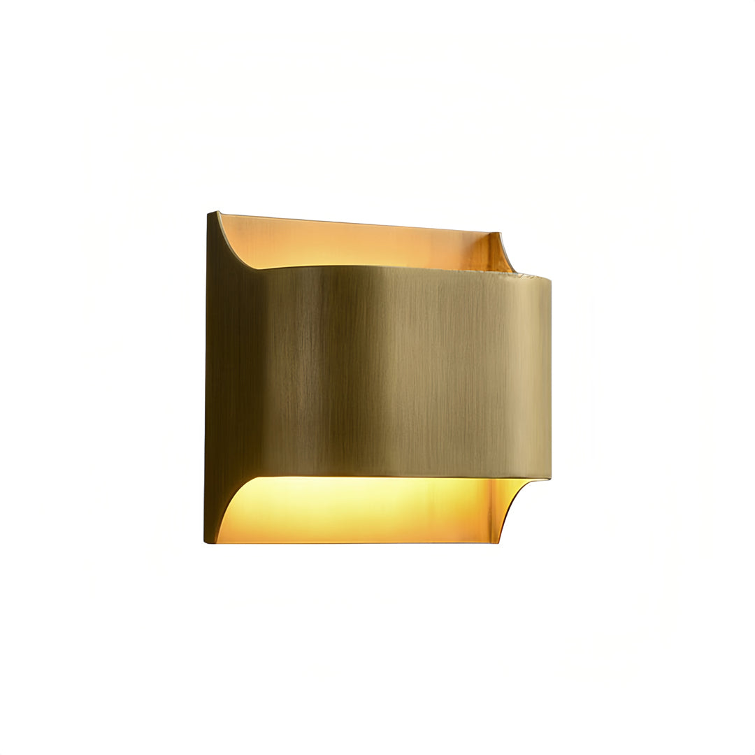 Front view of brass wall light indoor spotlight lamp showcasing curved edges and upward and downward light glow.