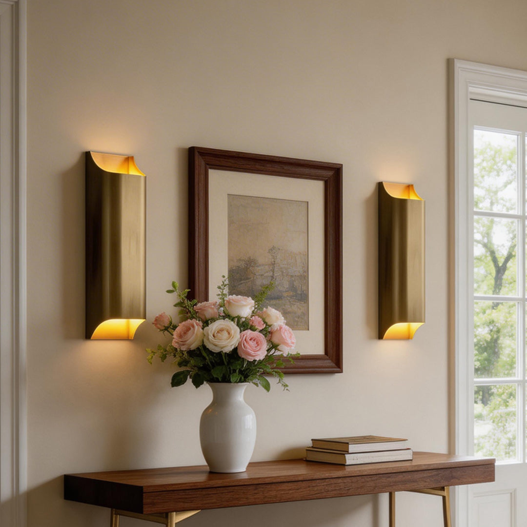 Elegant hallway with dual brass wall light indoor spotlight lamp fixtures enhancing wall decor and ambiance.