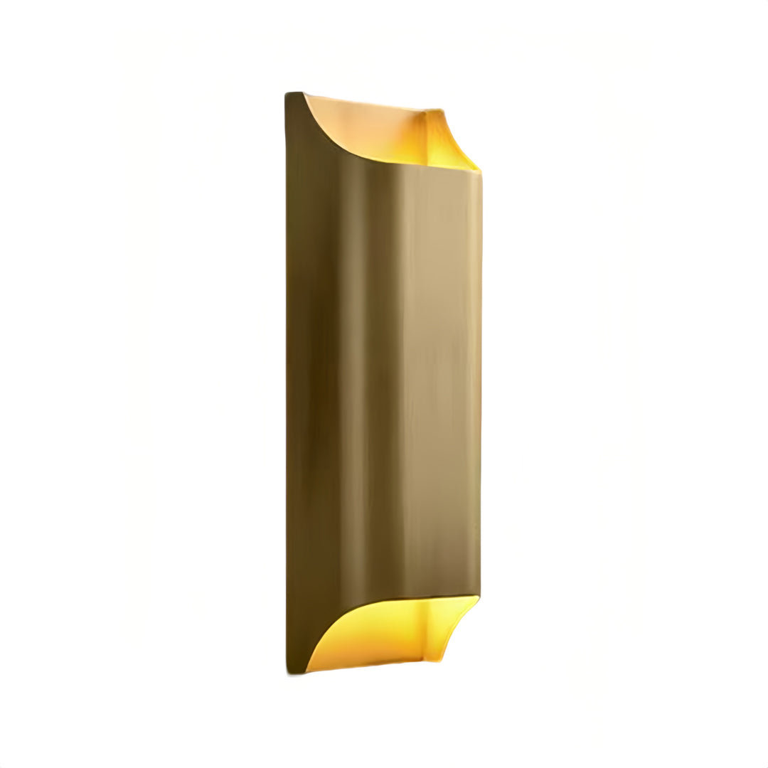 Side profile of brass wall light indoor spotlight lamp with modern sculptural shape and warm lighting effect.