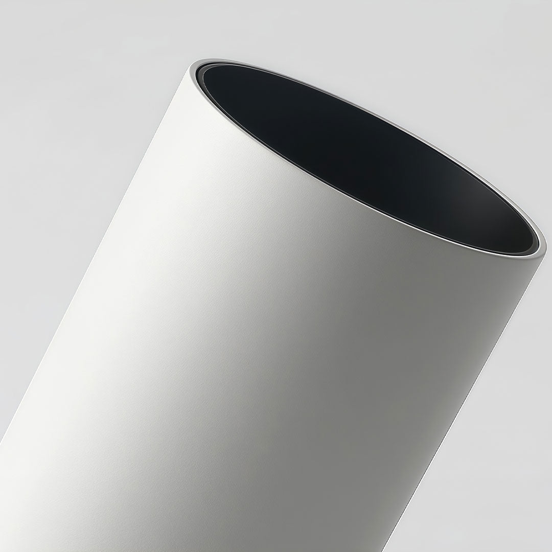 Indoor spotlight lamp showing a cylindrical shape with a clean white exterior and a visible light lens.