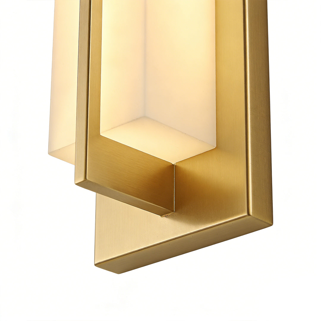 Close-up of gold wall lighting indoor spotlight lamp showing layered frame and soft diffused light panel.