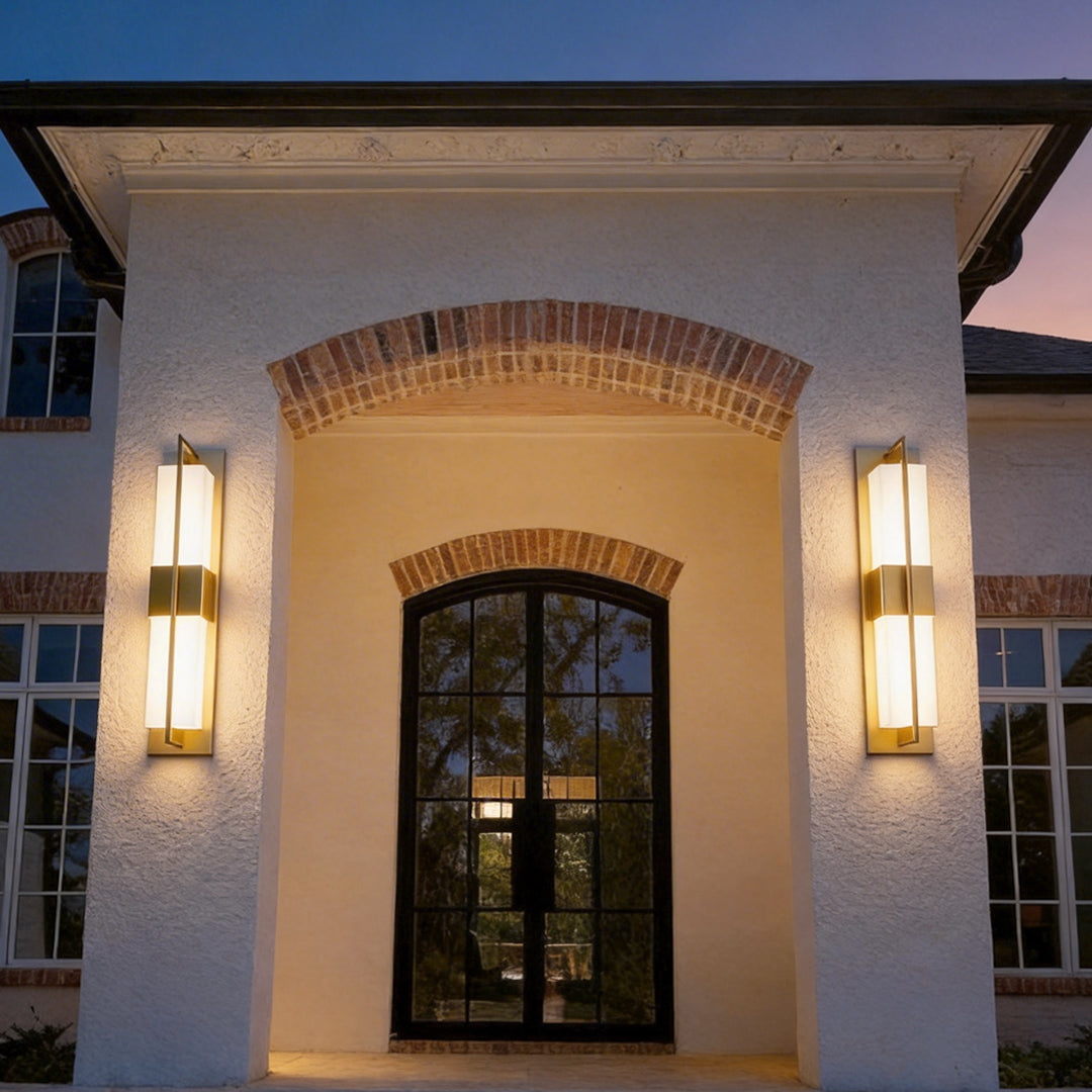 Luxury home entrance enhanced by gold wall lighting indoor spotlight lamp on both sides of doorway.
