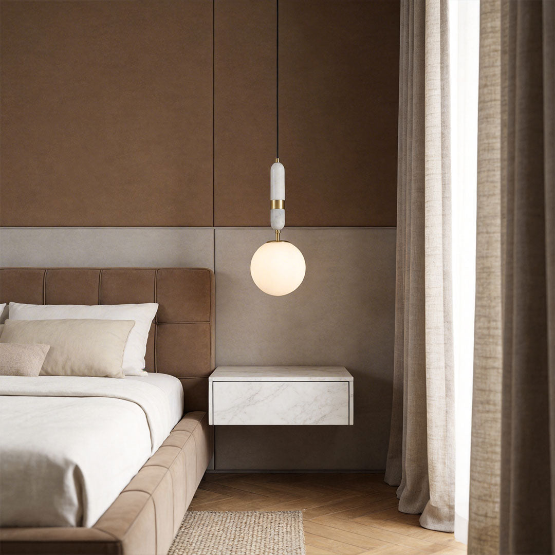 Modern bedroom with modern globe pendant light indoor spotlight lamp hanging beside bed with soft warm glow.