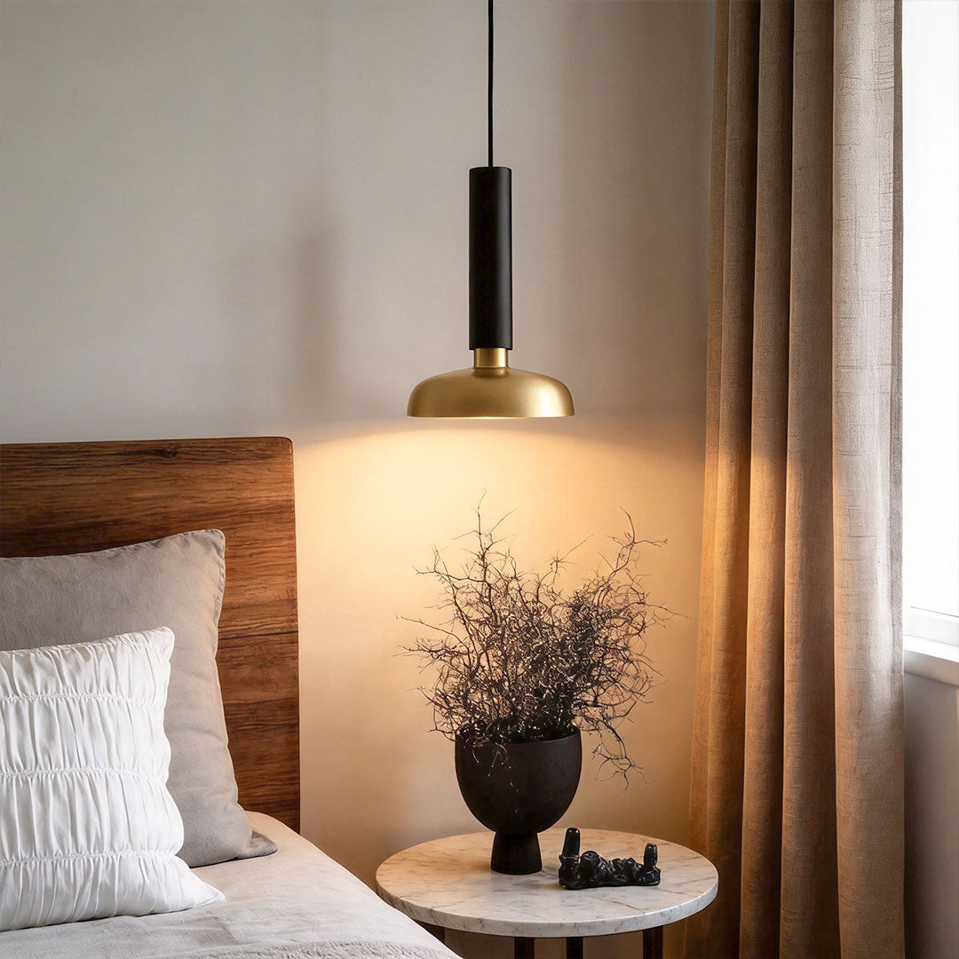 Bedroom corner styled with nordic light pendant indoor spotlight lamp creating soft warm bedside lighting.