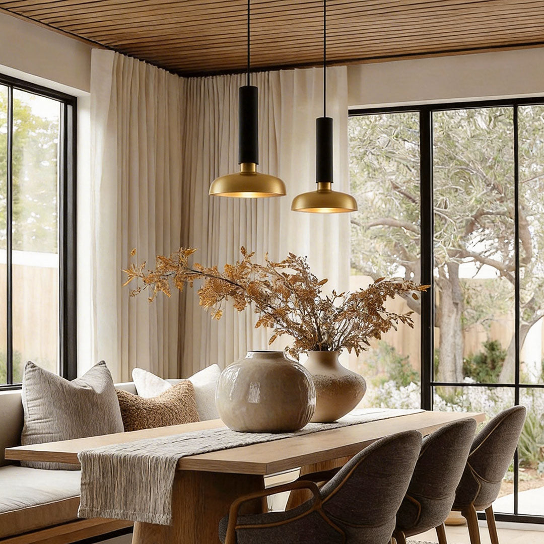 Scandinavian dining space with nordic light pendant indoor spotlight lamp above wooden table and natural decor.