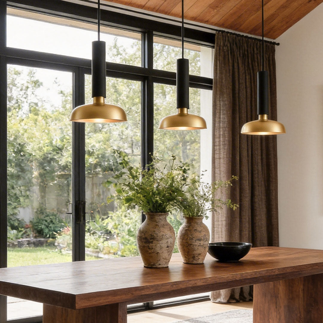 Modern dining area featuring multiple nordic light pendant indoor spotlight lamp fixtures with natural light.
