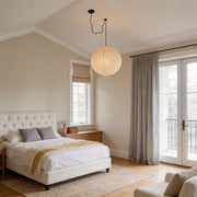 Bedroom with paper pendant light fixtures indoor spotlight lamp creating soft warm ambient lighting.