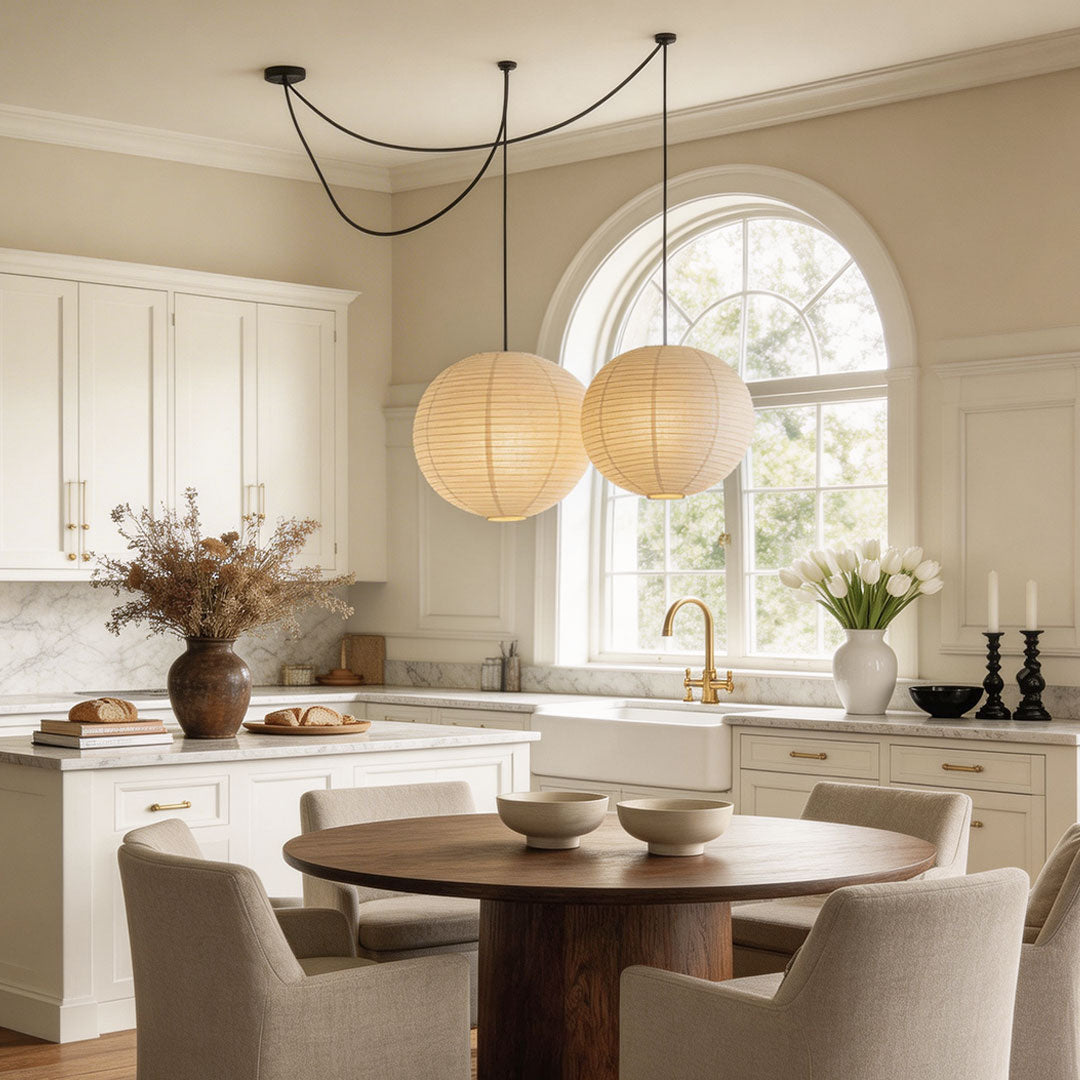 Kitchen dining space with paper pendant light fixtures indoor spotlight lamp suspended from ceiling.