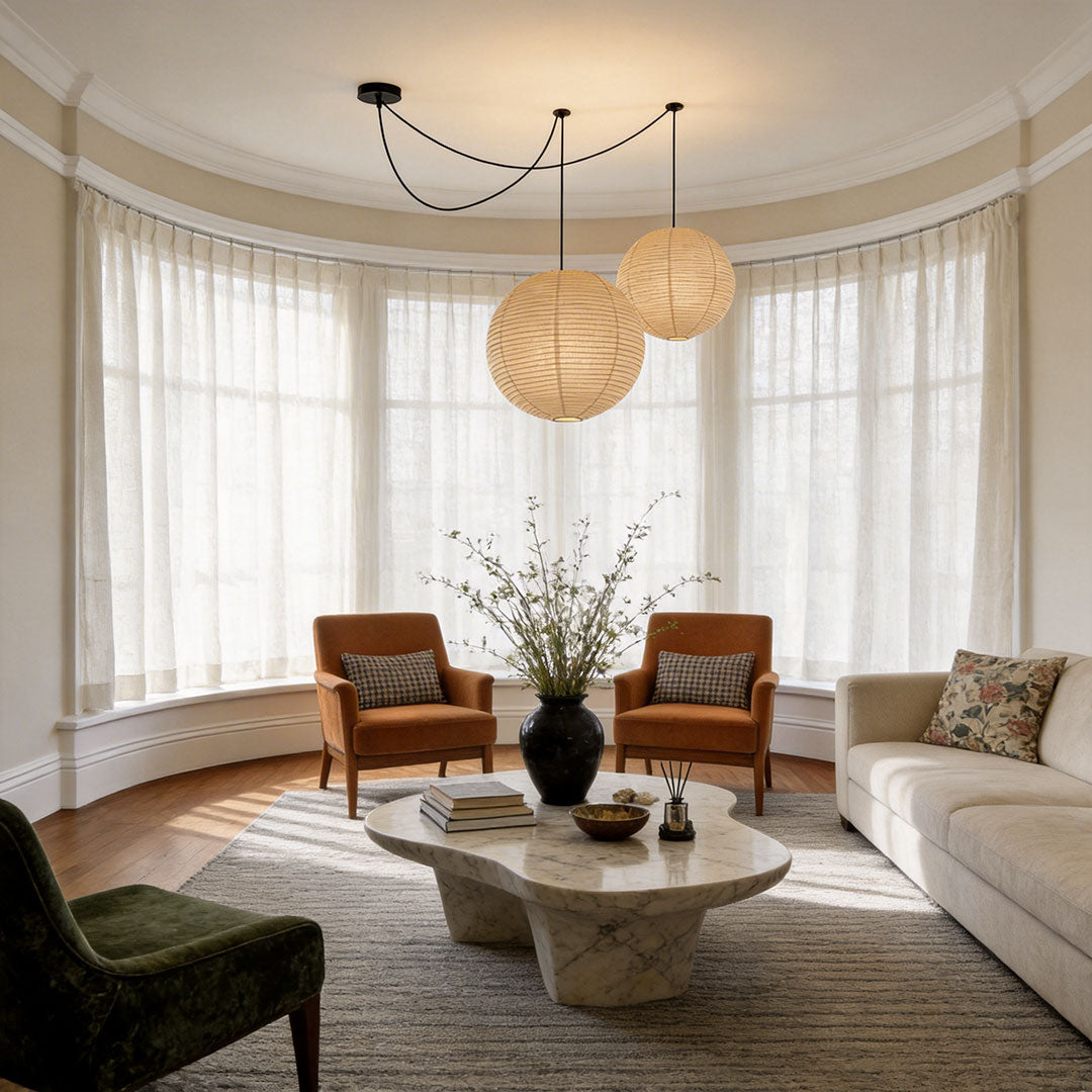 Living room featuring paper pendant light fixtures indoor spotlight lamp adding soft diffused glow.