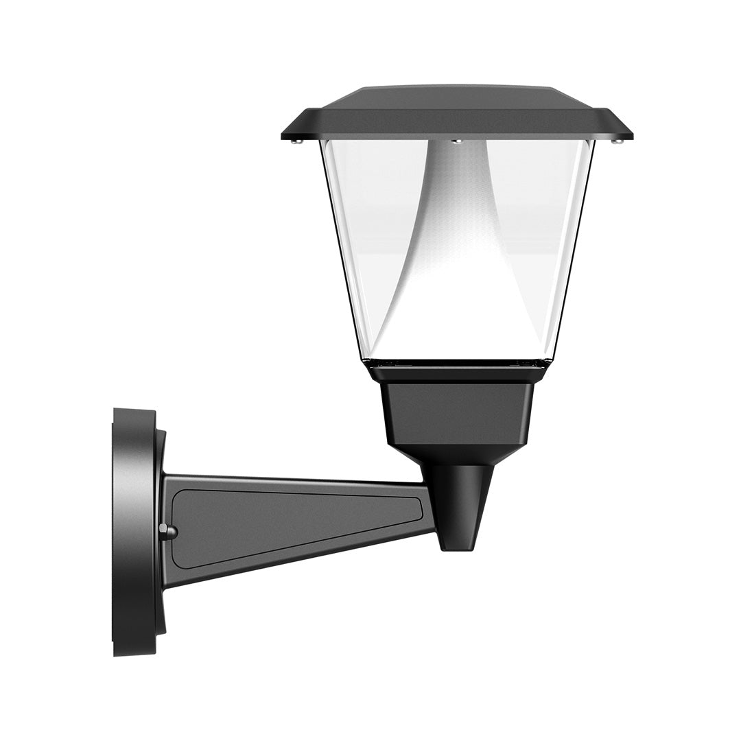 Elegant residential entrance featuring warm outdoor lighting and Mediterranean-style architectural details