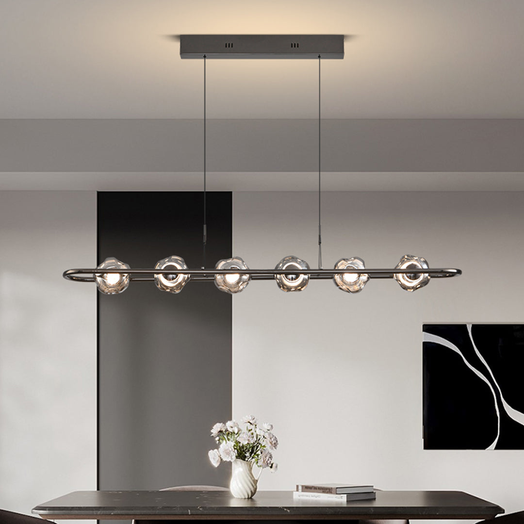 Industrial rise and fall pendant light with black finish positioned over modern kitchen island