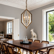 Industrial-style brown pendant lights with a dark bronze cage and inner fabric shade, hanging over a light wood kitchen island.