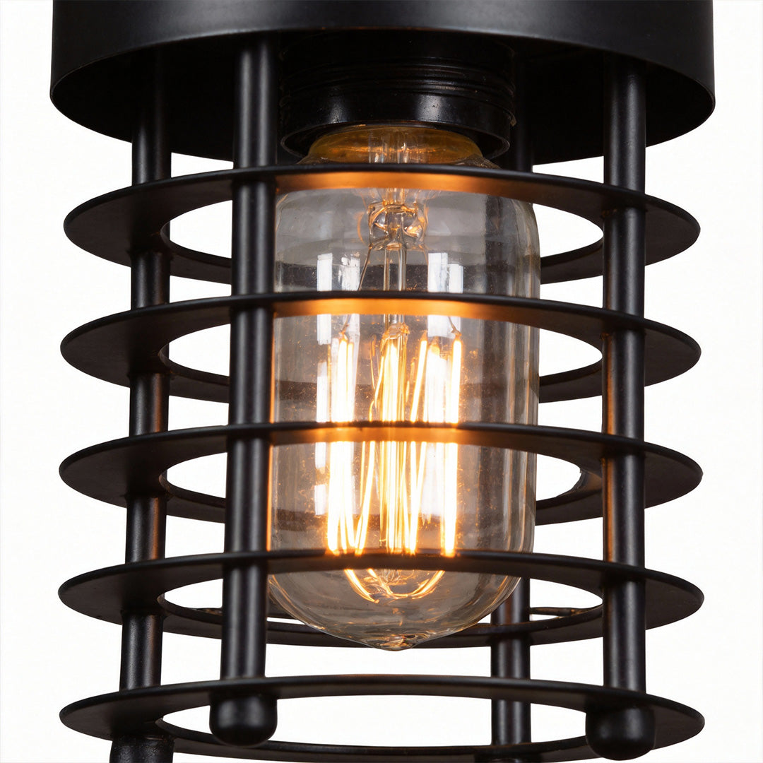 Close-up view of an industrial cage pendant light showing the bulb and metal guard.