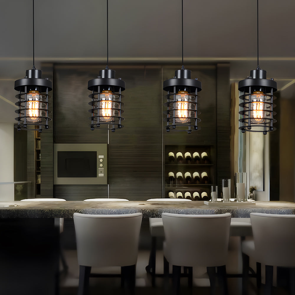 Industrial cage pendant lights installed over a kitchen island with bar seating.