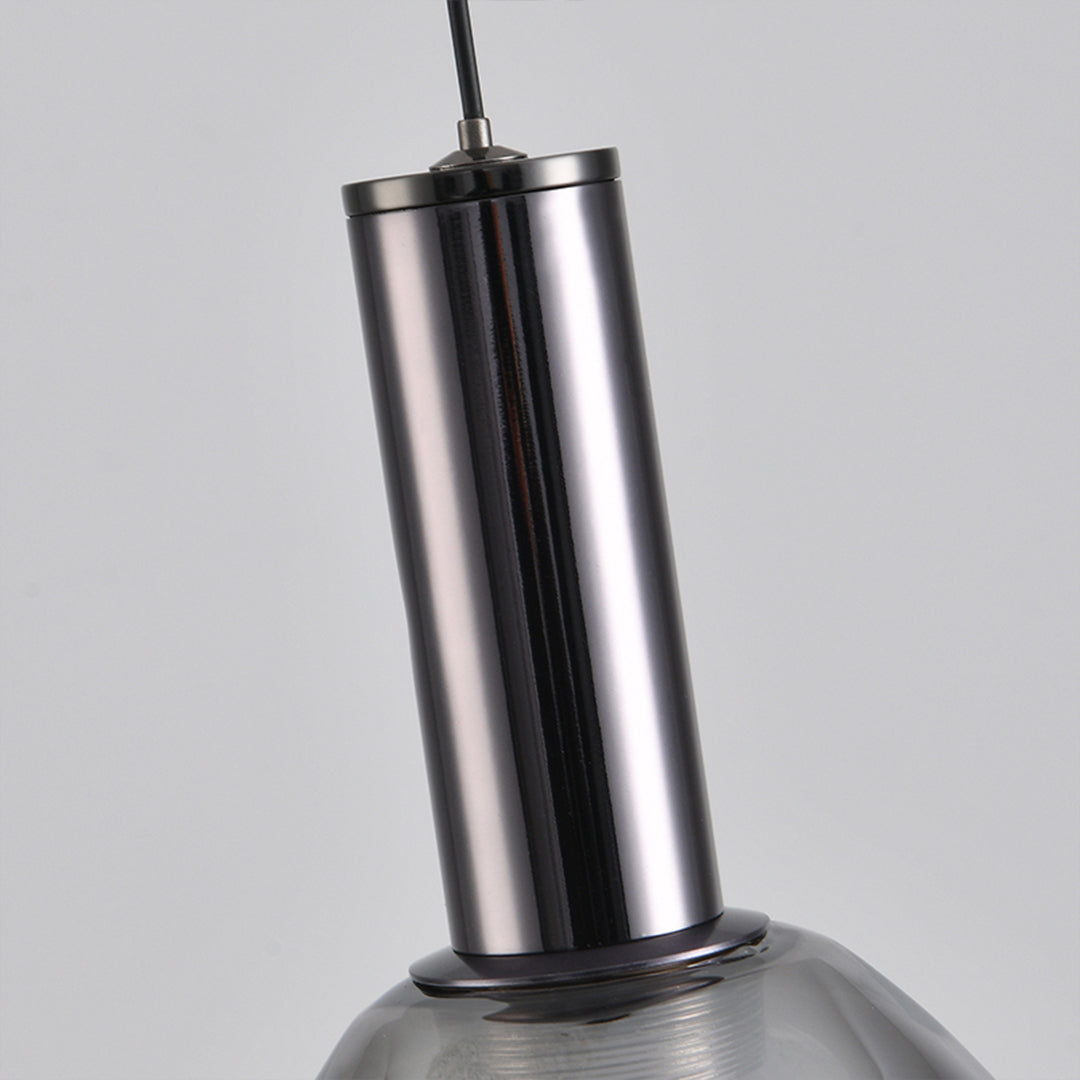 Industrial drum pendant lights with polished metal finish and modern cylindrical shape