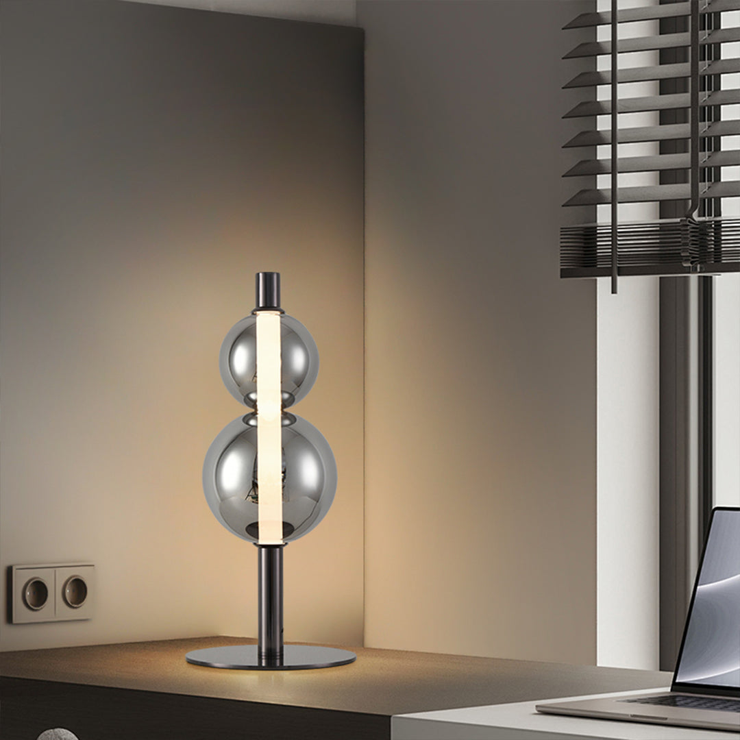 Industrial art table lamp with reflective metal spheres and minimalist black stand design