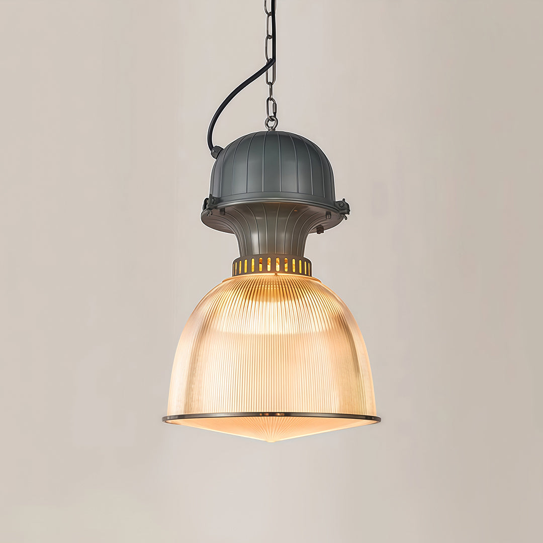 Single industrial style pendant lighting against neutral wall showcasing ribbed glass and metal details