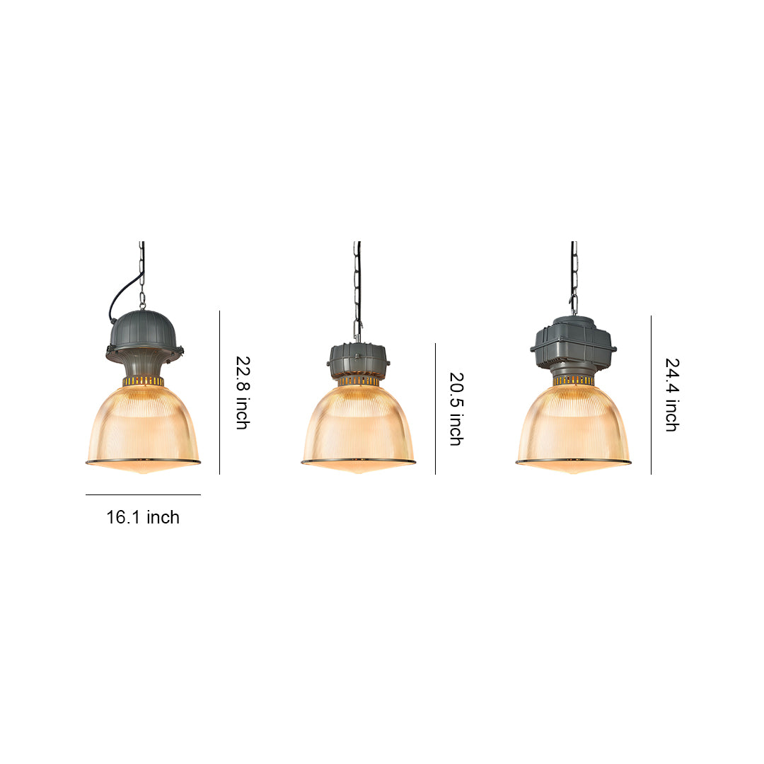 Multiple industrial style pendant lighting fixtures in varying sizes with ribbed glass shades and metal caps