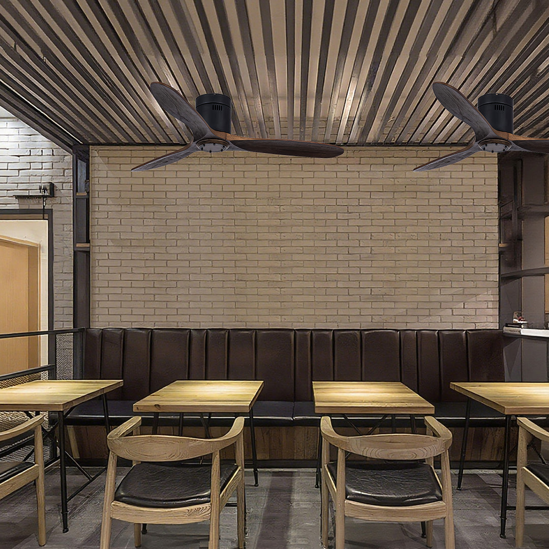 Industrial three blade wooden ceiling fan with light in modern commercial space with exposed ceiling