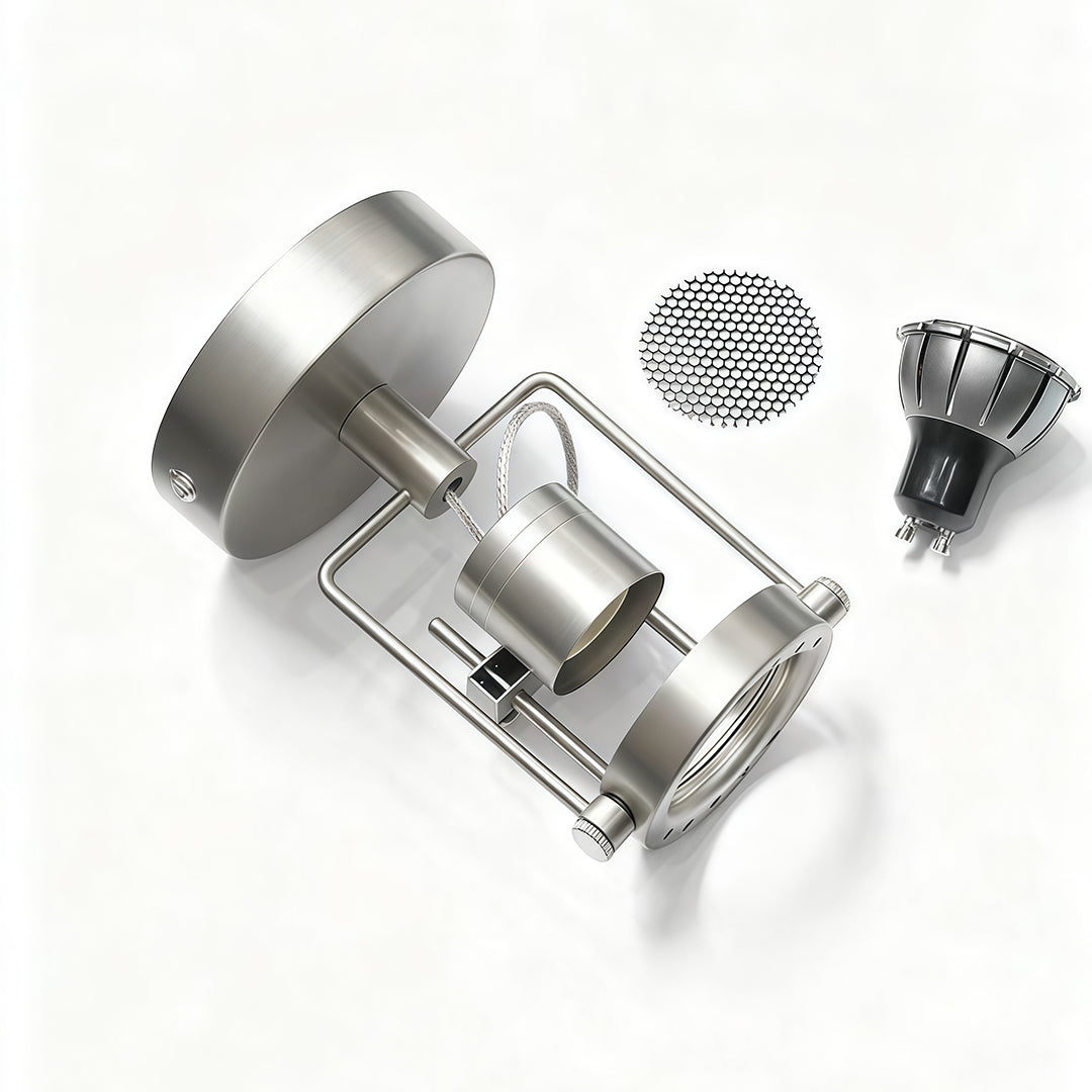 Disassembled industrial wall lights showing mounting components and interchangeable decorative mesh screen accessories