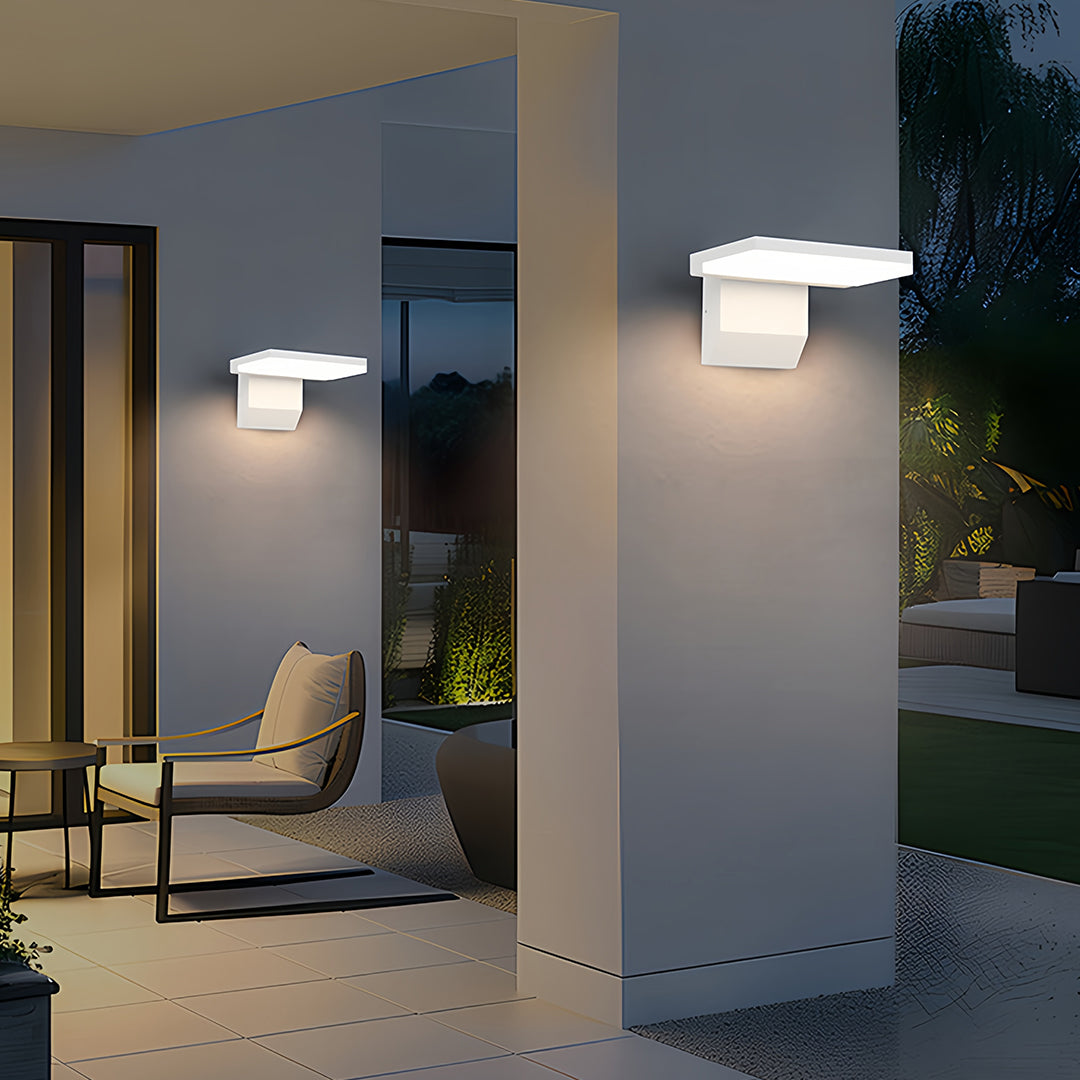 Pair of industrial wall lights flanking contemporary home entrance with warm downward illumination