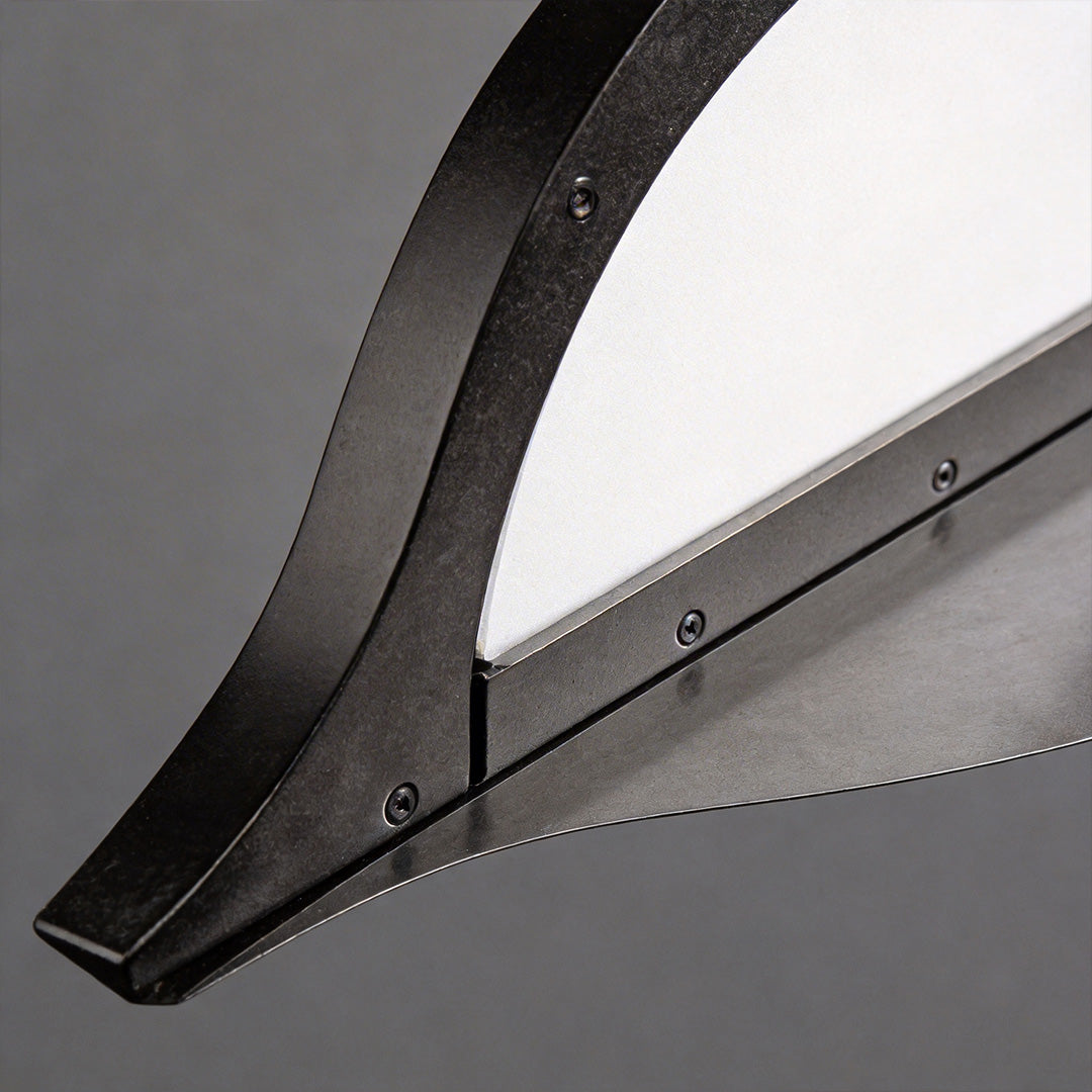 Inground landscape lights with a sleek design, mounted along a landscaped garden.