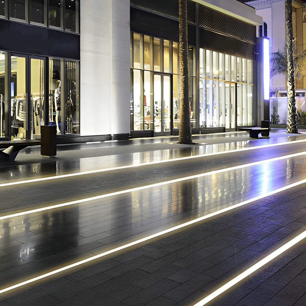 Inground linear lighting with a sleek design, installed along a circular walkway.
