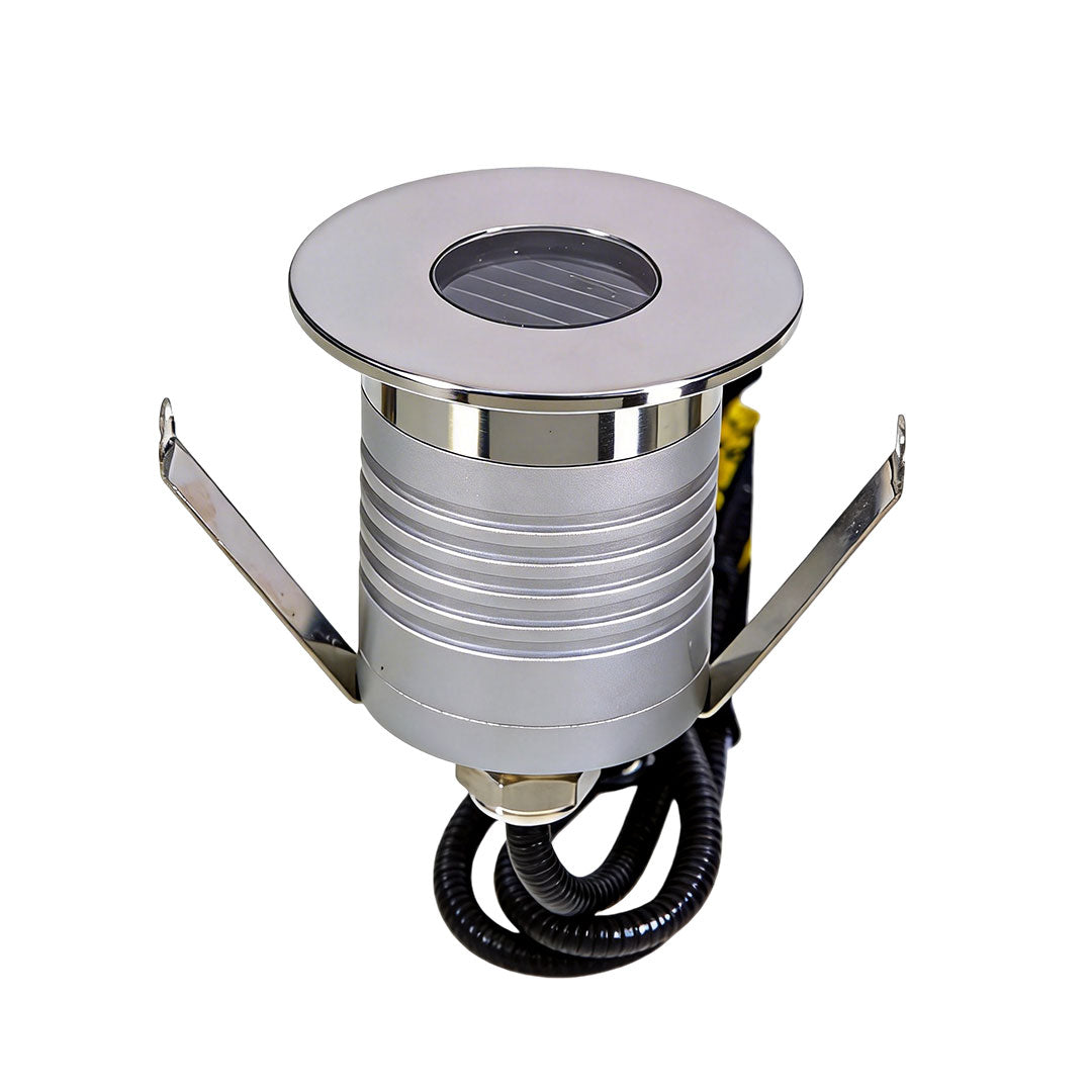 Inground well light with a modern design, providing ambient lighting.