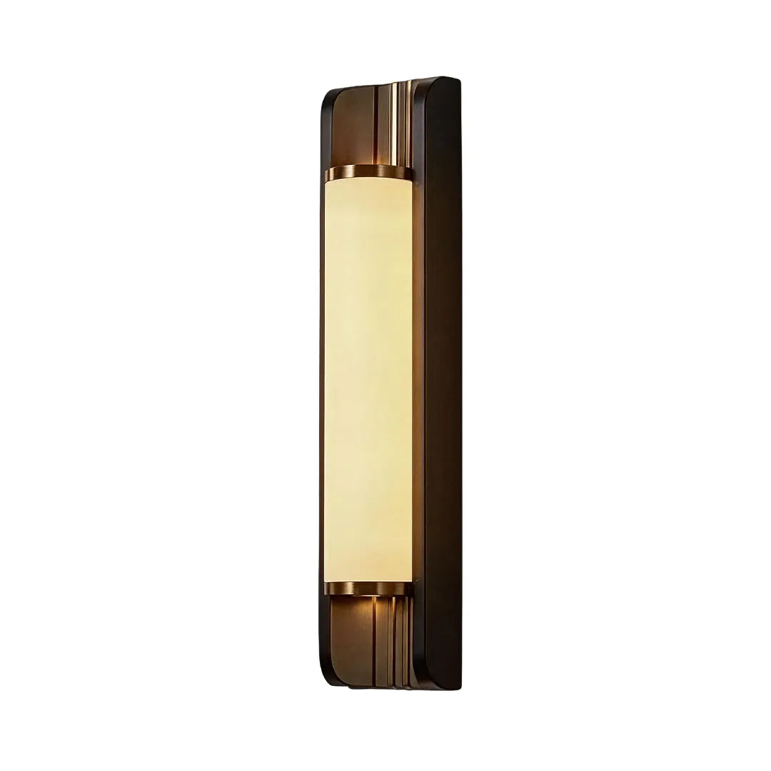 Up down outdoor wall sconce installed beside a front entrance creating architectural lighting effects.
