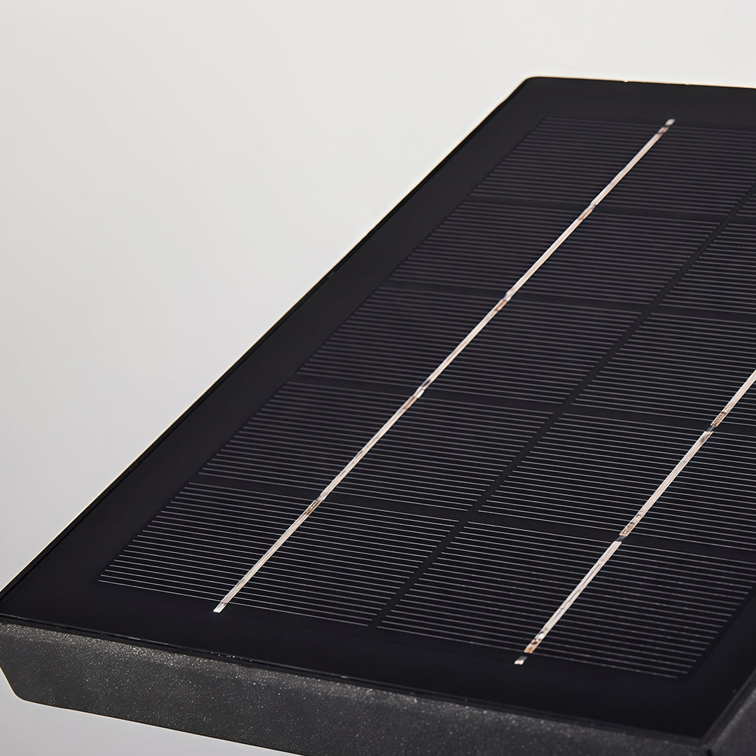 Detailed close-up of the integrated solar panel on top of the wall mount outdoor light fixtures.