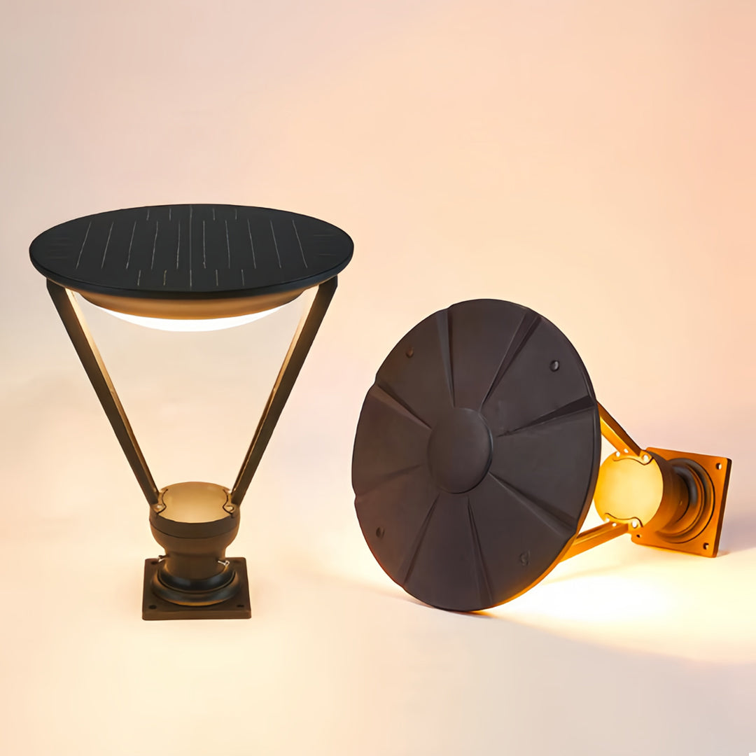 Detailed product view of the integrated solar panel and base of the external pillar lights in warm light.