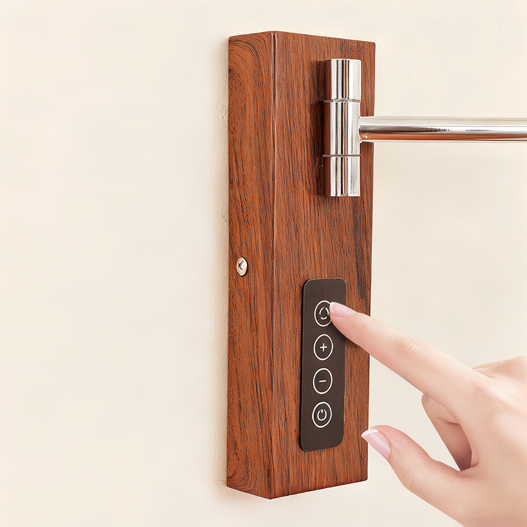 Close-up showing the integrated touch control panel on the wooden base of the swing wall light fixture.