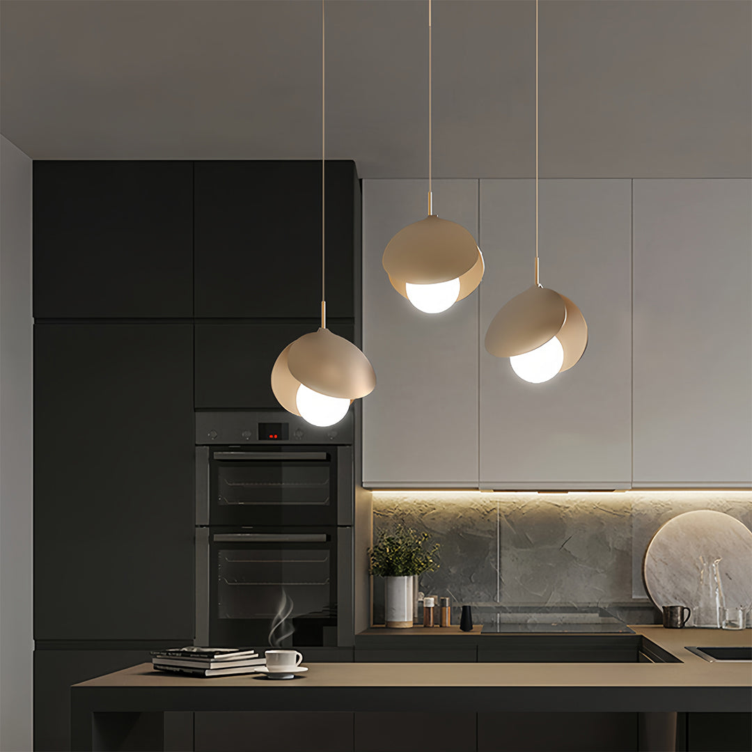 Contemporary interior showcasing 3 bulb pendant light with mixed shade styles and warm illumination